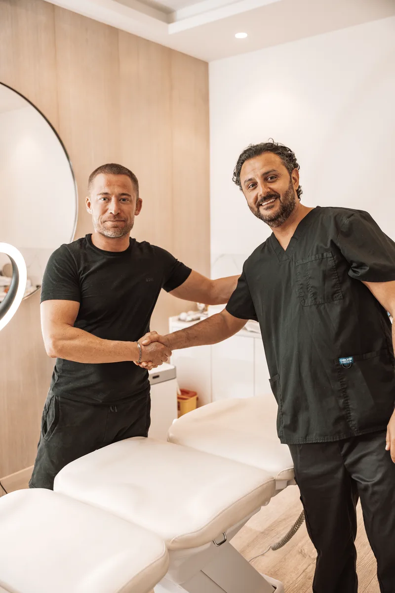 Dr. Arvin Yarollahi with a patient at CellOrtho Marbella following regenerative orthopaedic treatment